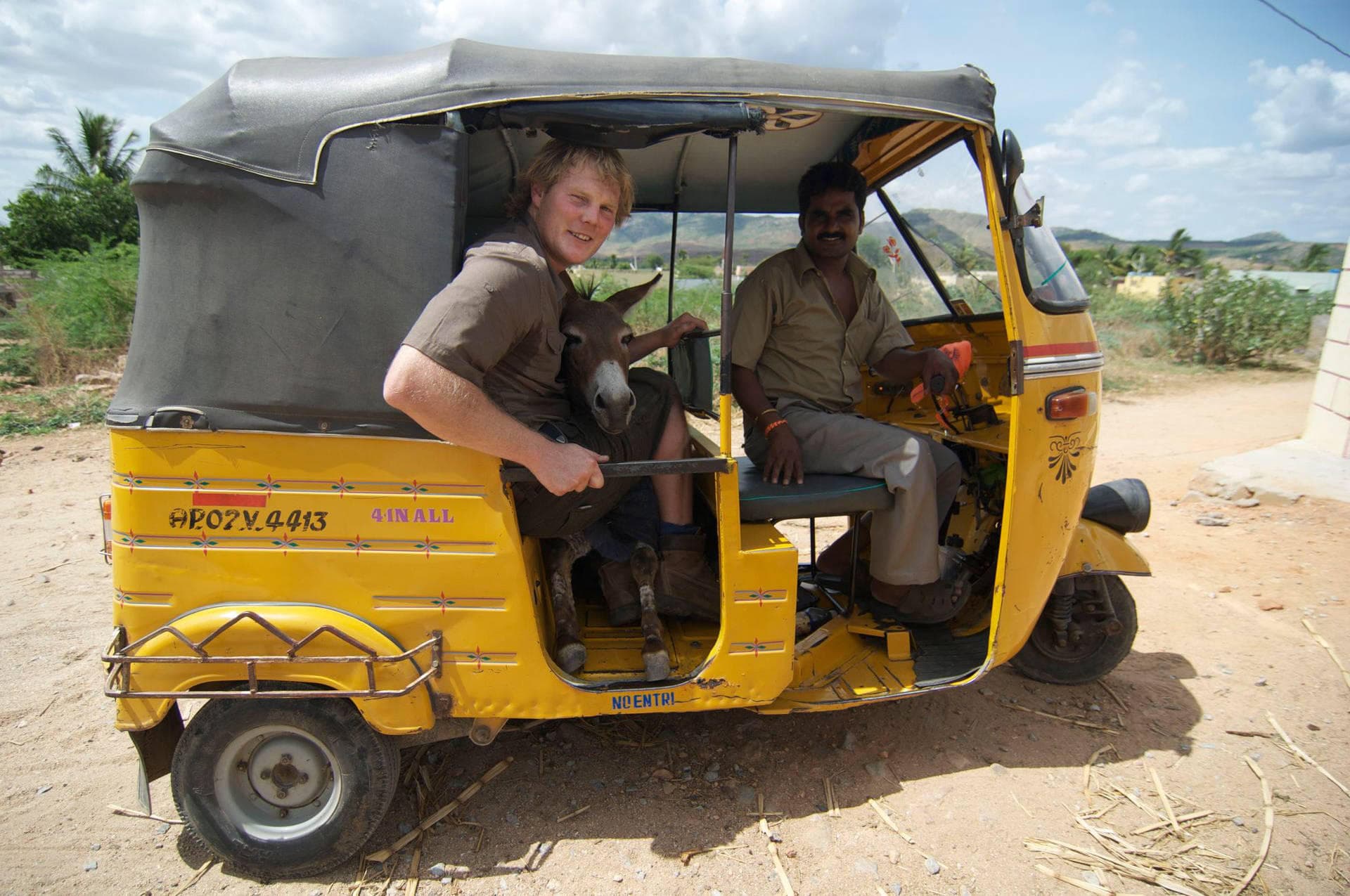Luke in a tuk tuk... with a donkey